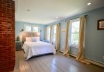 Upstairs bedroom with queen bed and daybed